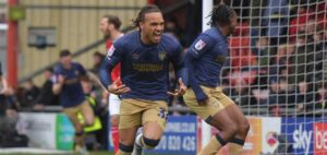 John-Kymani Gordon celebrates after scoring for AFC Wimbledon